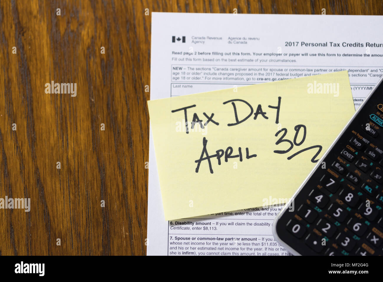 Canada Tax Day April 30 Stick note plus calculator Stock Photo Alamy