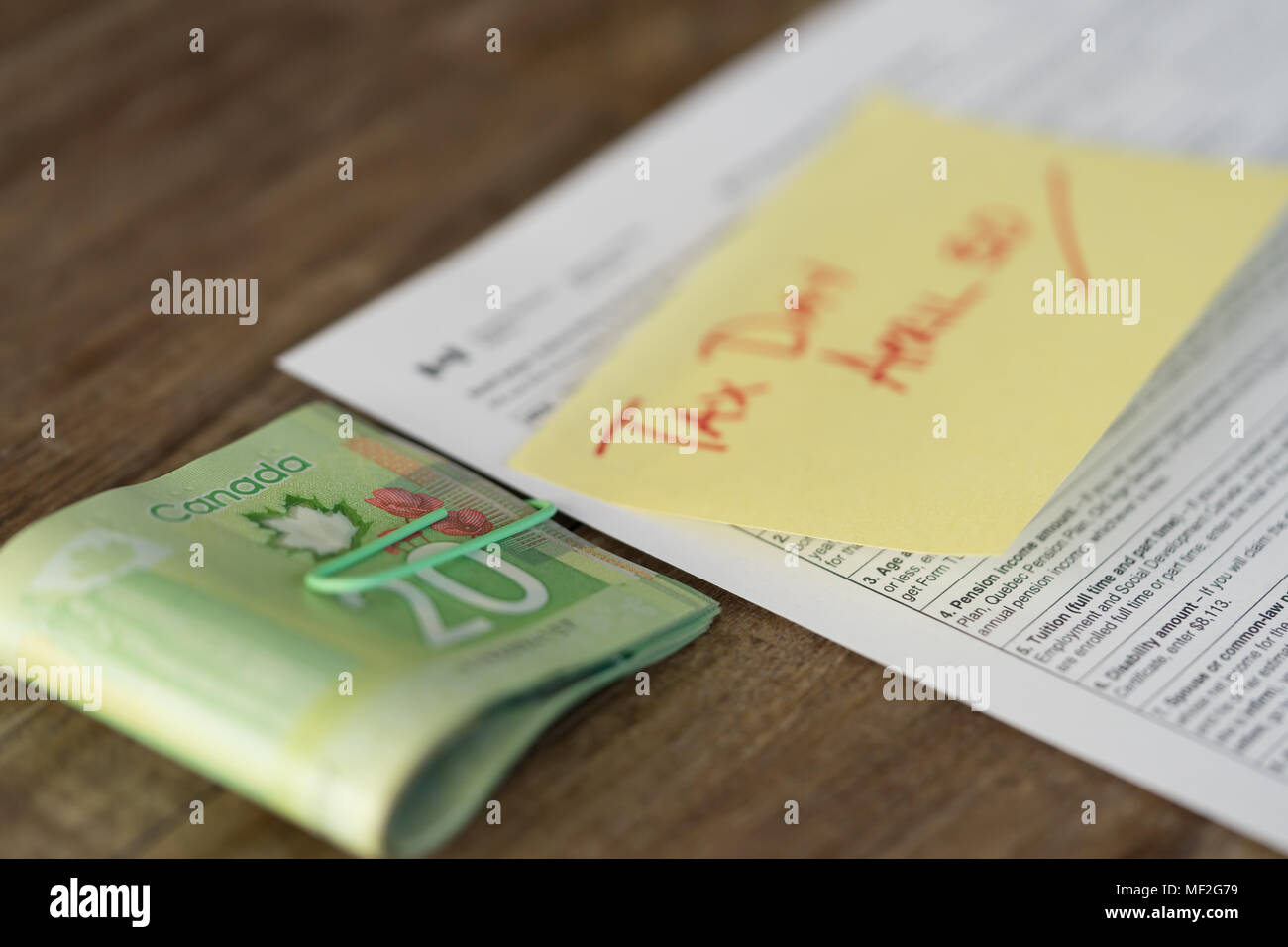 April 30 Canada Tax Day - Tax Form with Cash Refund Stock Photo - Alamy