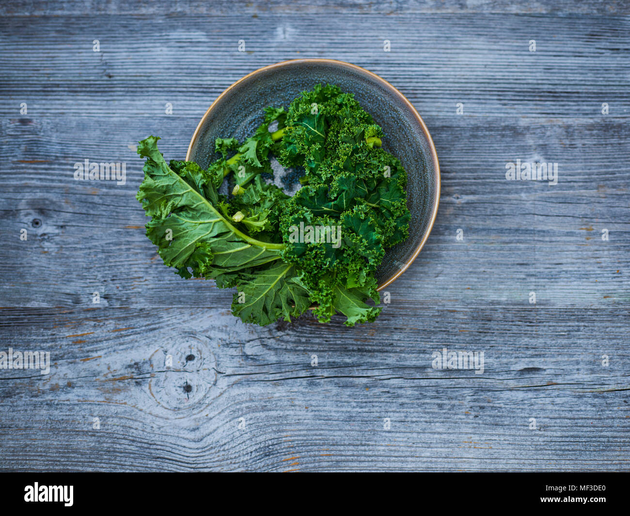 Kale leaves in bowl Stock Photo
