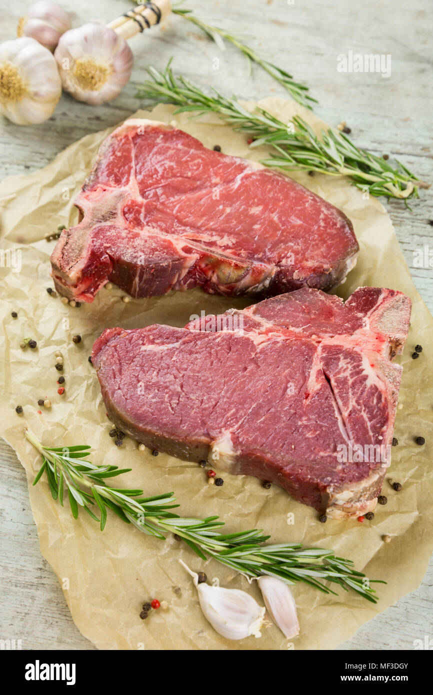 Raw dry-aged T-bone steaks Stock Photo