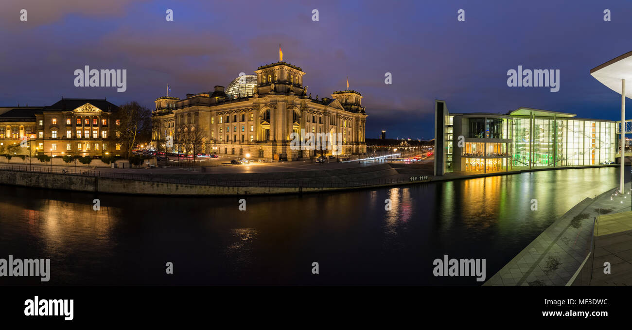 Germany, Berlin, Reichstag and Paul Loebe Government Building at Spree river in the evening Stock Photo