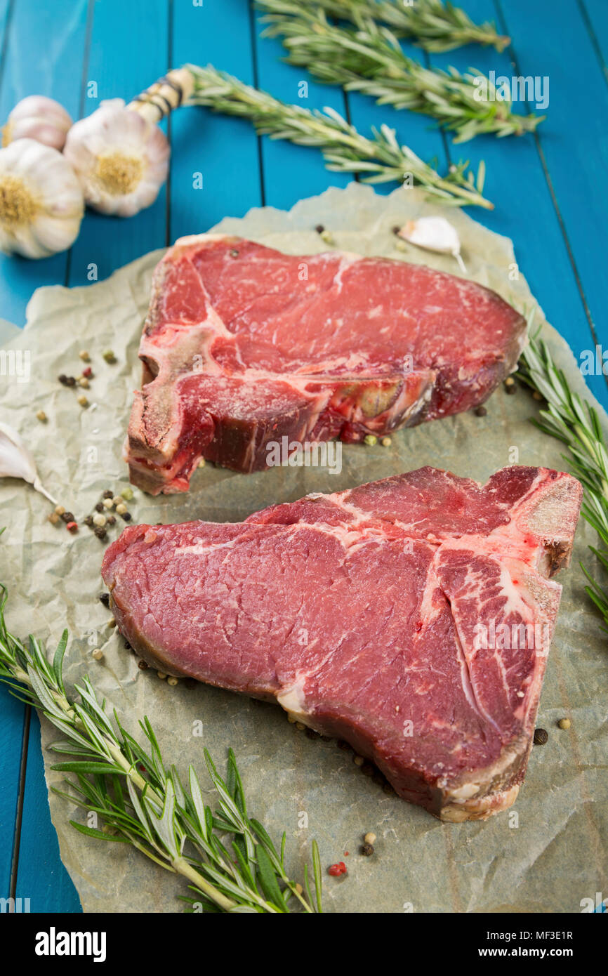 Raw dry-aged T-bone steaks Stock Photo