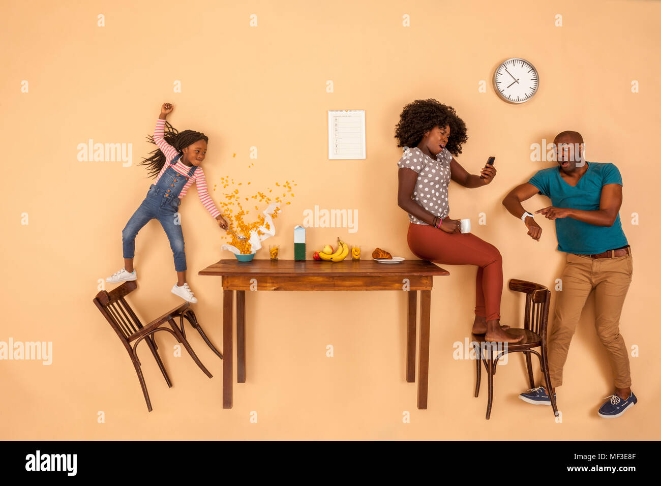 Stressed out family having breakfast in the kitchen Stock Photo