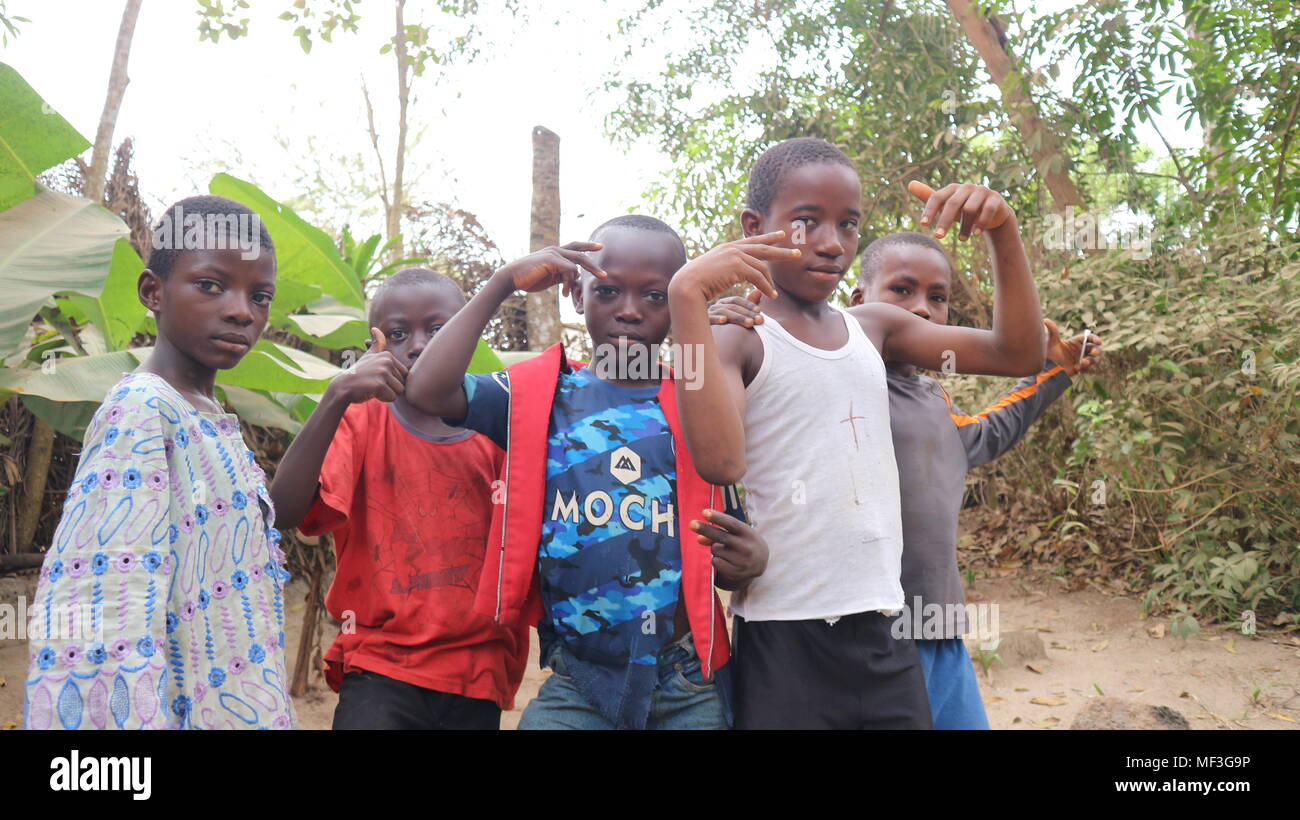 Group of young Black African boys having fun posing in front of the camera, Sierra Leone Stock Photo