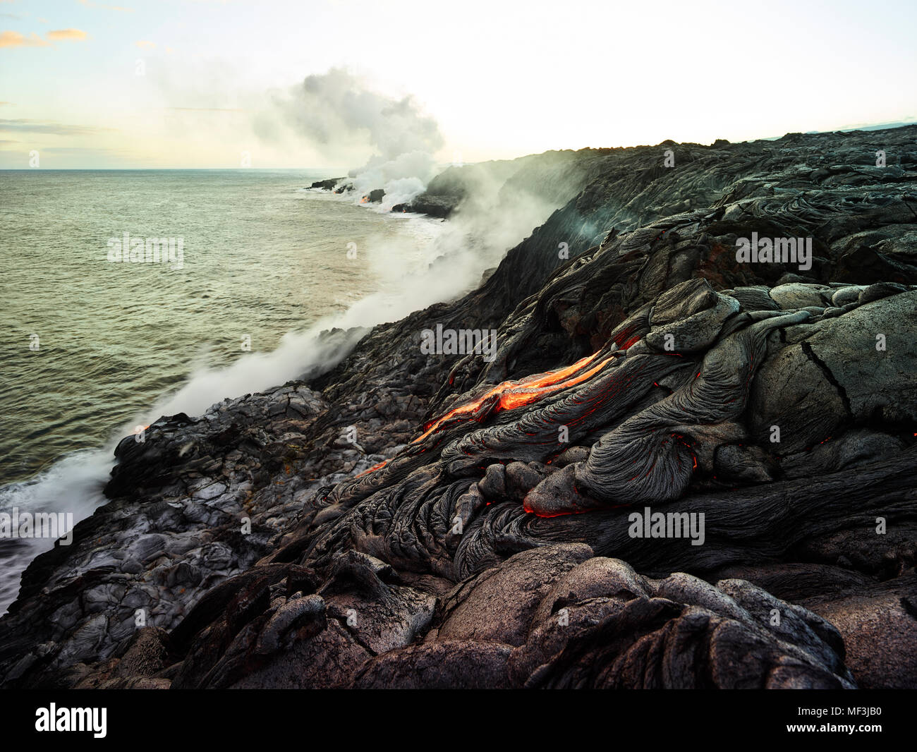 Hawaii, Big Island, Hawai'i Volcanoes National Park, lava flowing into pacfic ocean Stock Photo