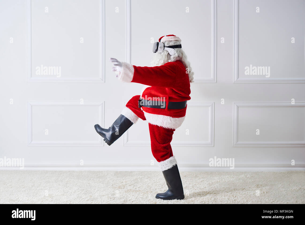 Santa Claus using Virtual Reality Glasses Stock Photo