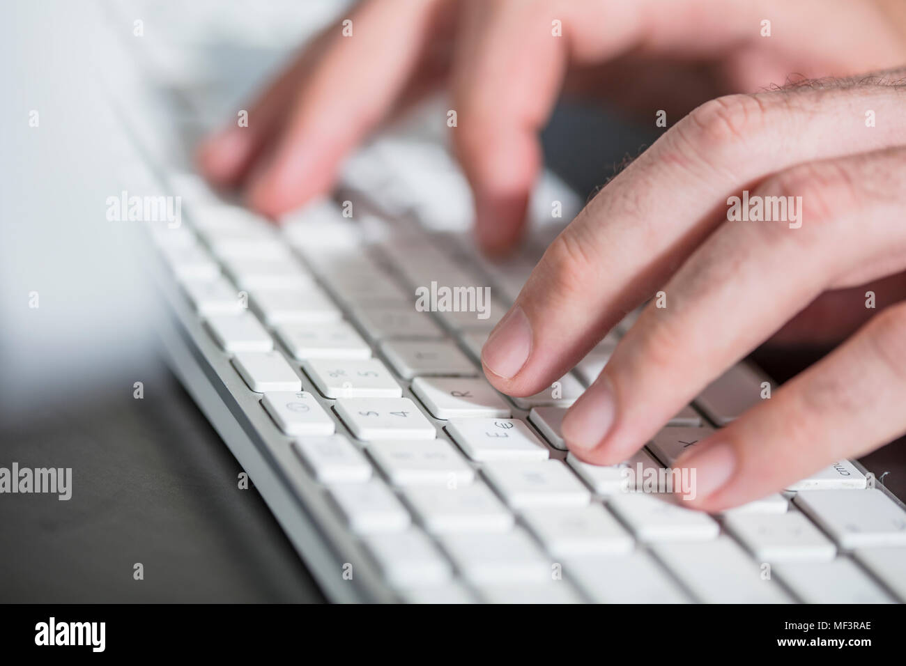 Hands on keyboard, close-up Stock Photo