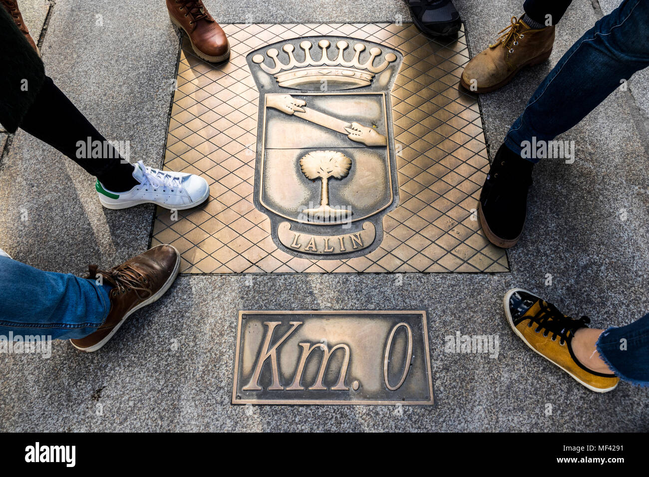 Lalin, Spain. Bronze plaque with the emblem of the city and marking the kilometer zero of the radial roads of Galicia Stock Photo