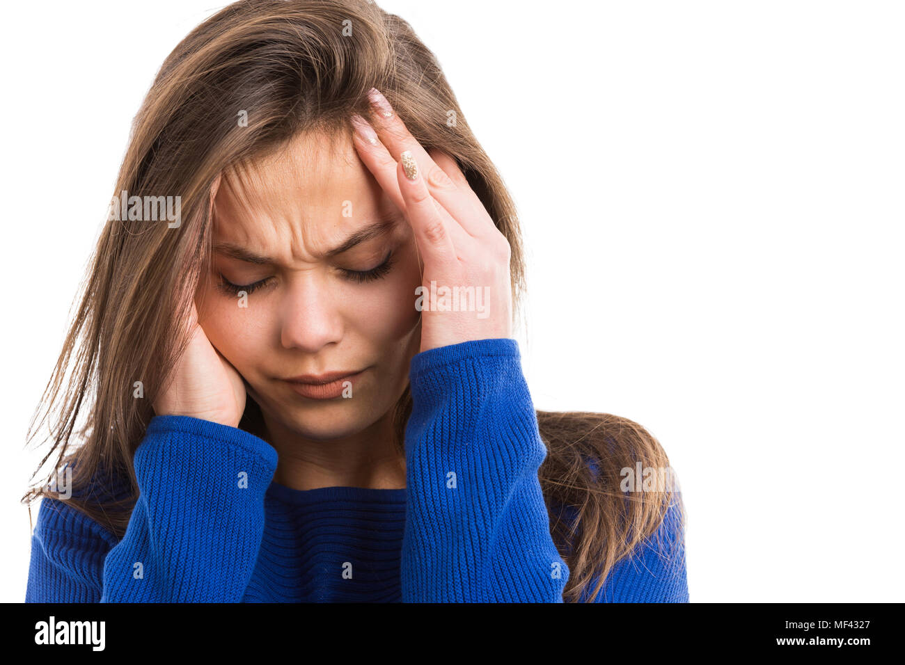 Young woman suffering head ache rubbing painful temples with hands as stress tension problem concept isolated on white background Stock Photo