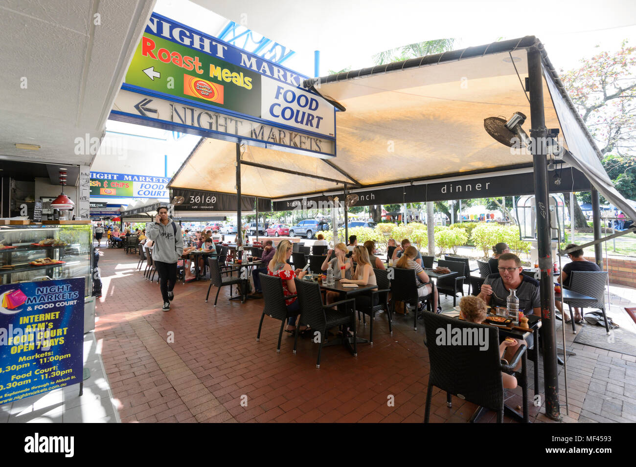 People sitting at the terrace of a restaurant eating al fresco, Cairns town centre, Far North Queensland, FNQ, QLD, Australia Stock Photo