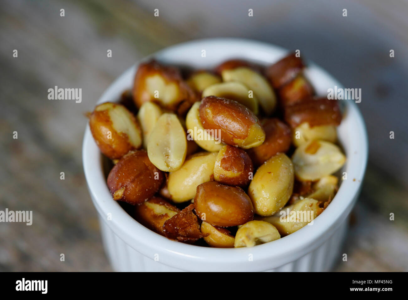 close up of beer nuts in a white bowl Stock Photo Alamy