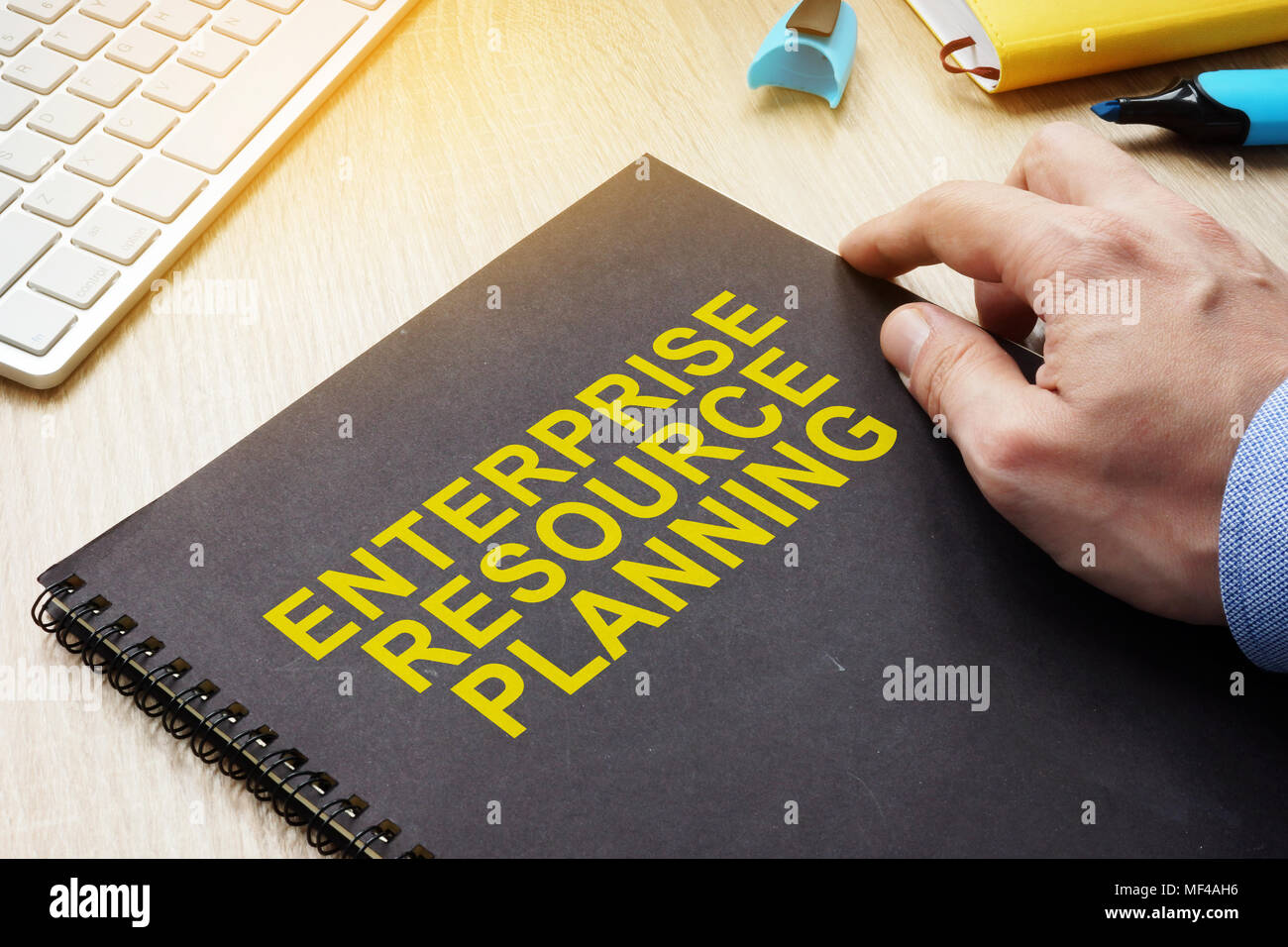 ERP Enterprise Resource Planning book on a table. Stock Photo