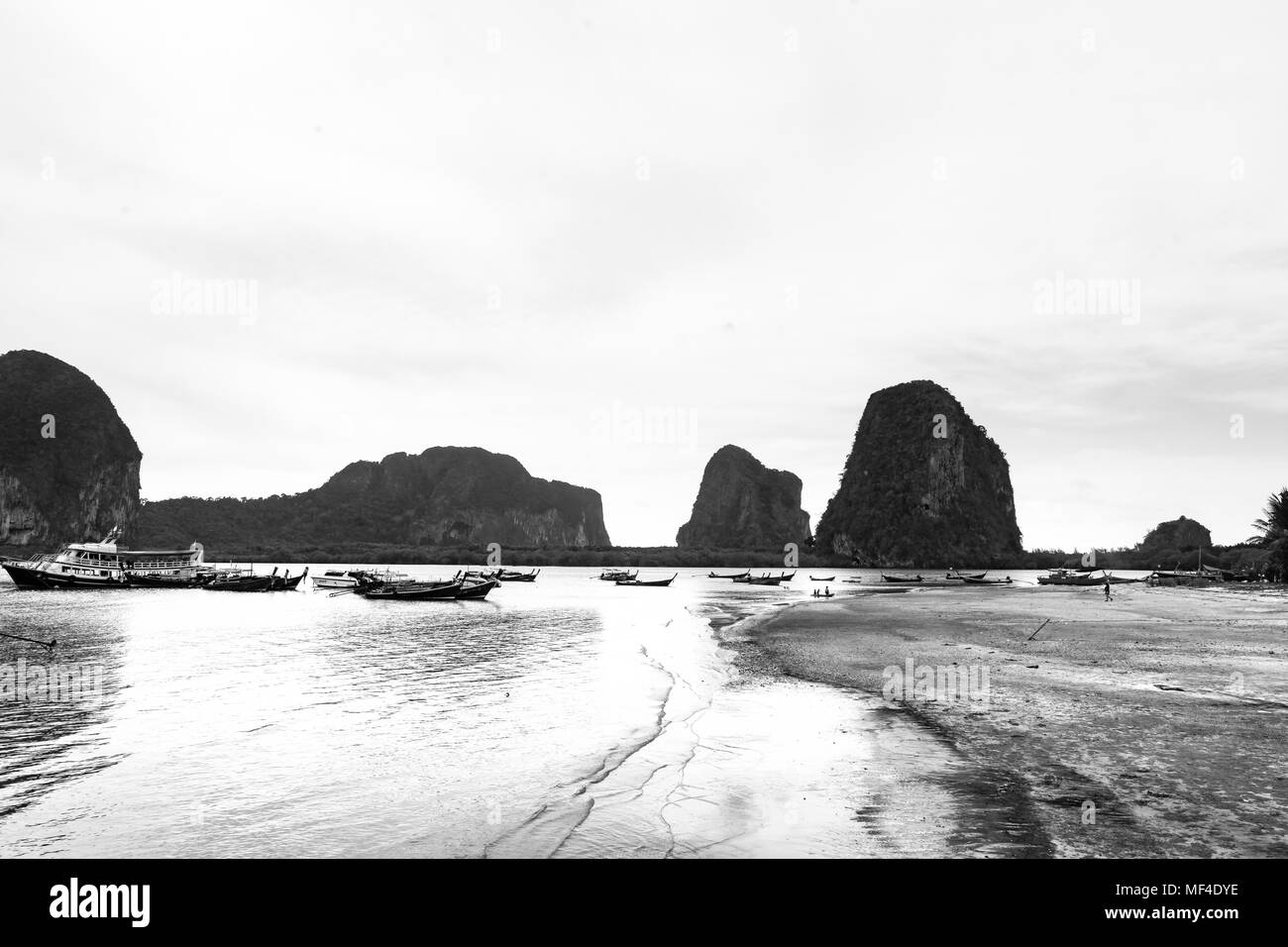 Picture of a fishing boat and island in the past ,Tone black and white. Stock Photo