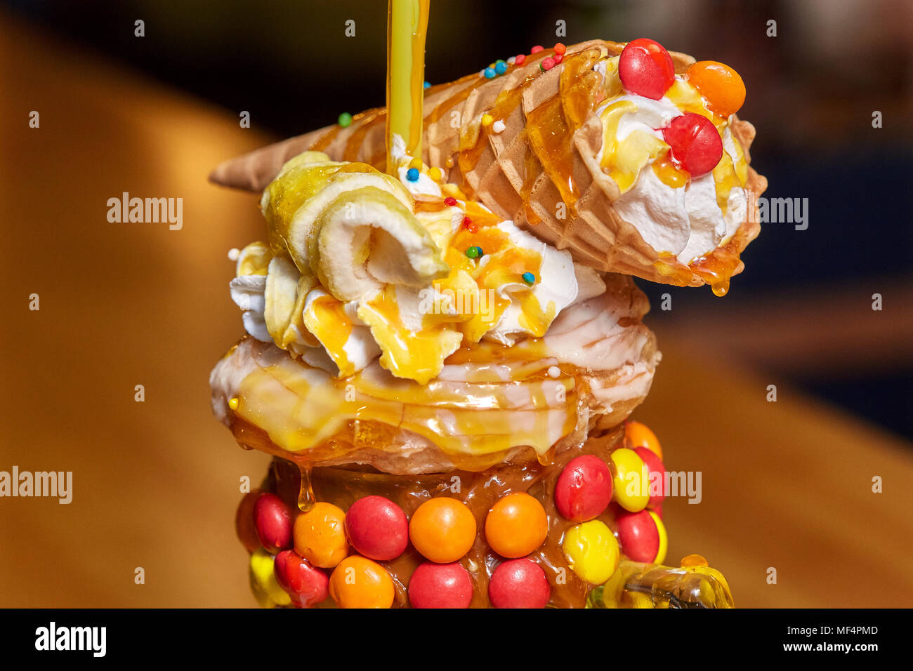 Caramel marshmallow candy milk shake cocktail with whipped cream