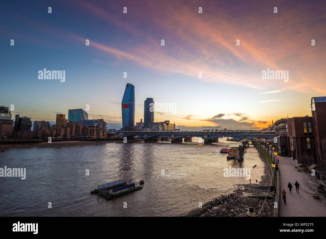 London, England - Beautiful sunset in London with skyscrapers and Blackfriars Bridge over River Thames Stock Photo