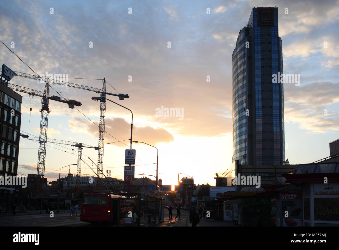 Setting sun over city in Central Europe Stock Photo