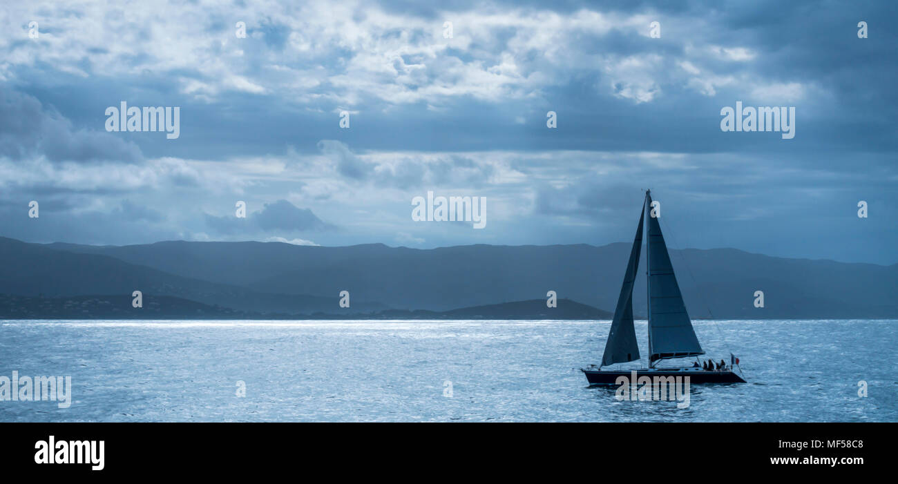 Corsica, sailing boat at coast Stock Photo