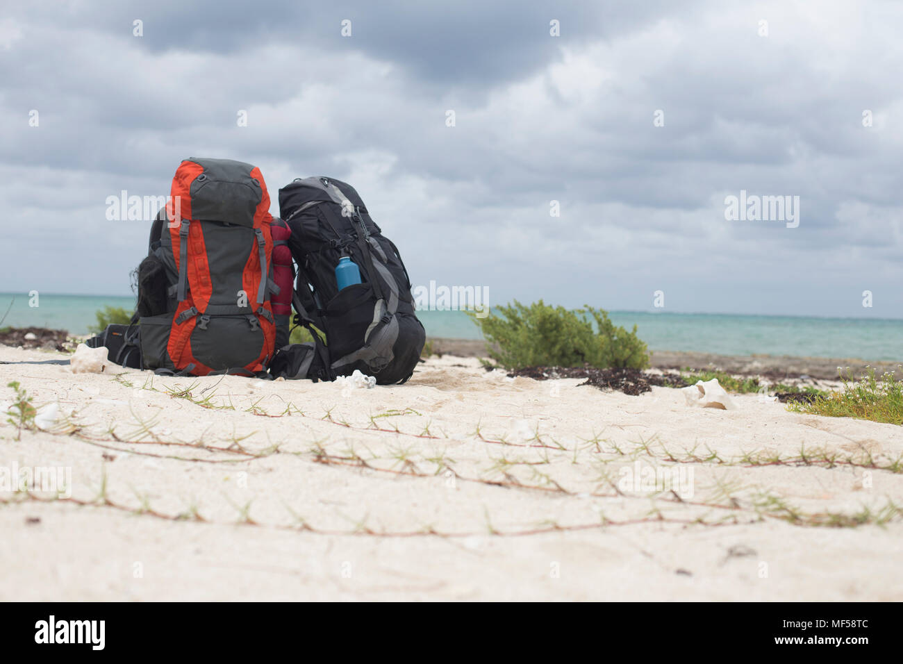 Cuba, Puerto Padre, Bahia de Malagueta, Two abandoned rucksacks on the beach Stock Photo