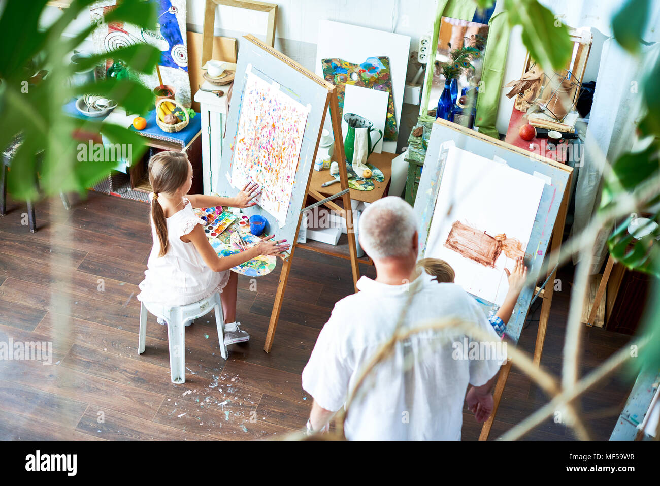 Children Painting Pictures in Art Studio Stock Photo