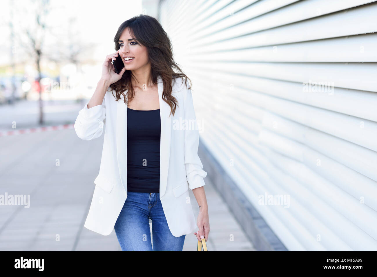 Portrait of smiling businesswoman on the phone Stock Photo