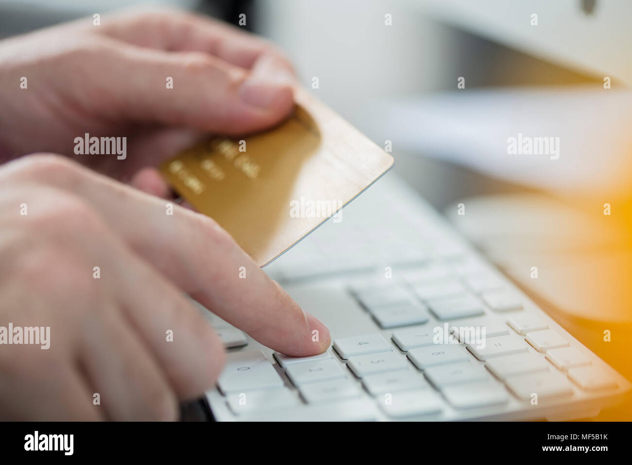Man making online payment with credit card, close-up Stock Photo
