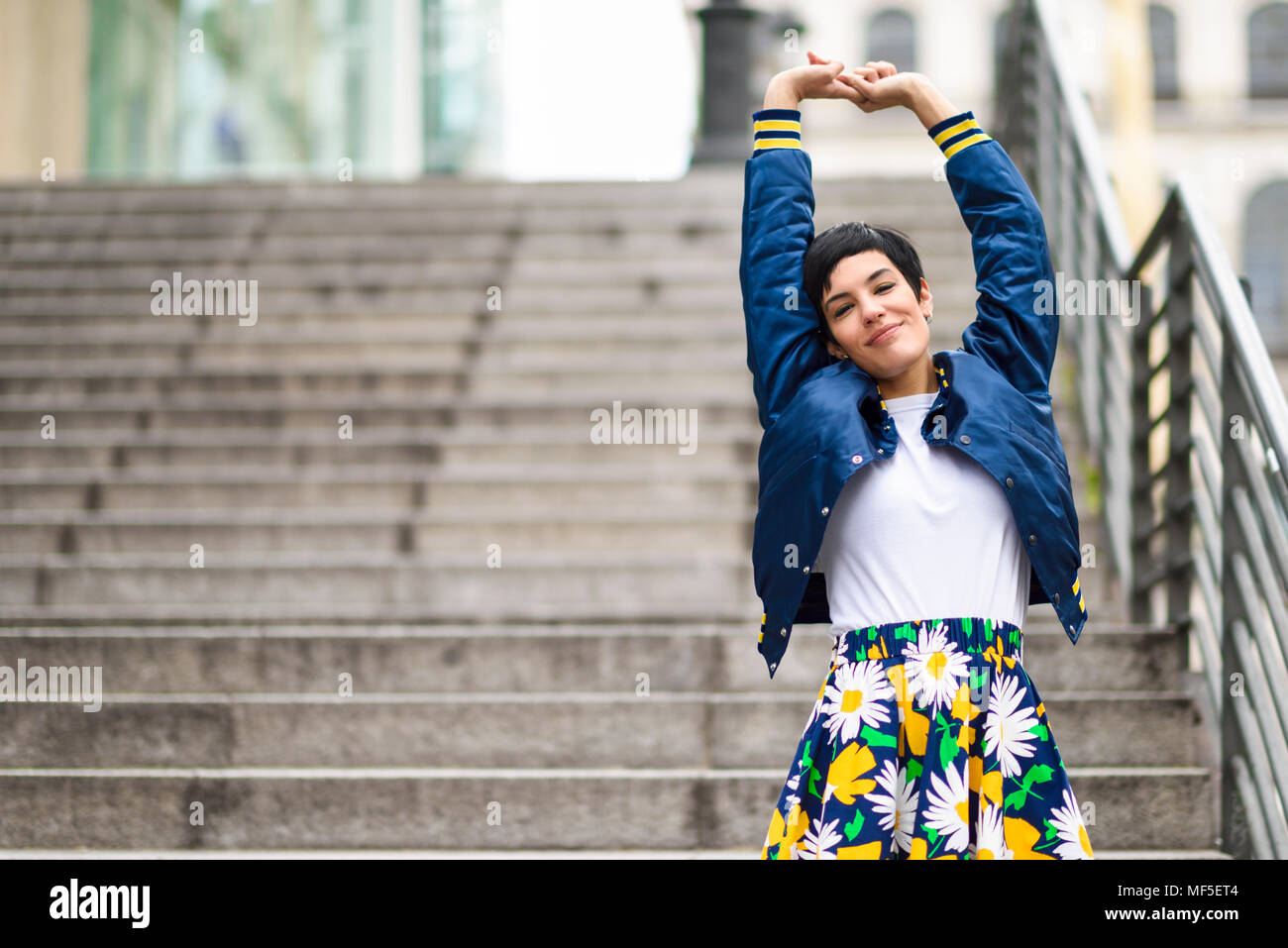 Portrait of fashionable young woman wearing skirt with floral design Stock Photo