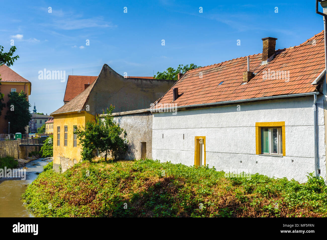 Red roof house and a small river Stock Photo - Alamy