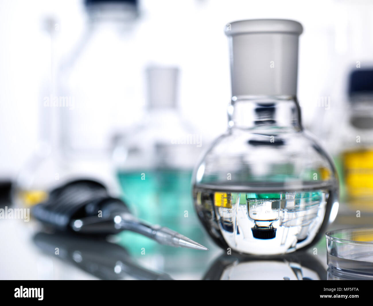 Pipette and laboratory glassware Stock Photo