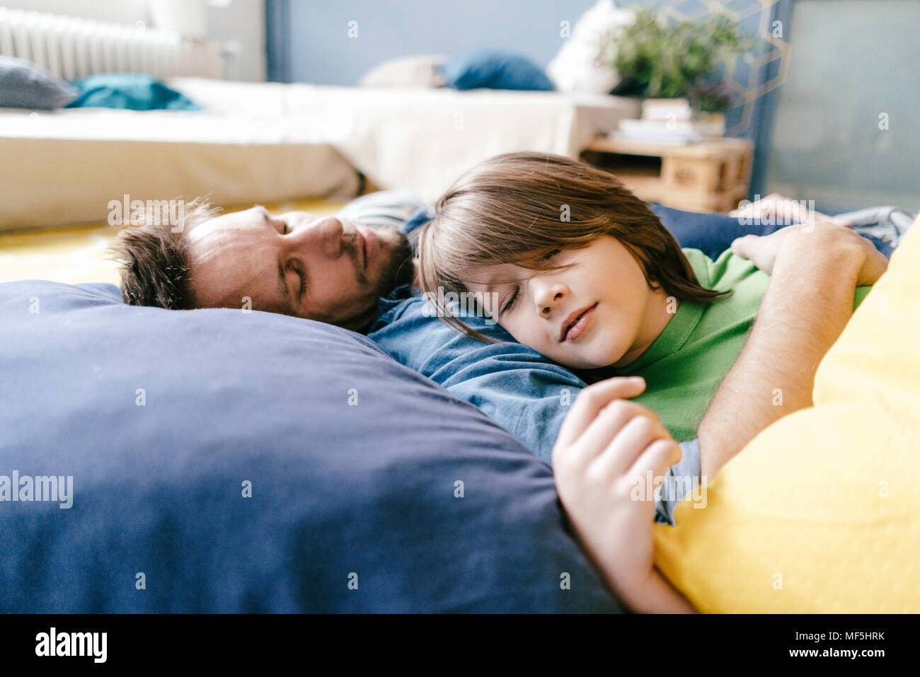 Father and son sleeping at home Stock Photo Alamy
