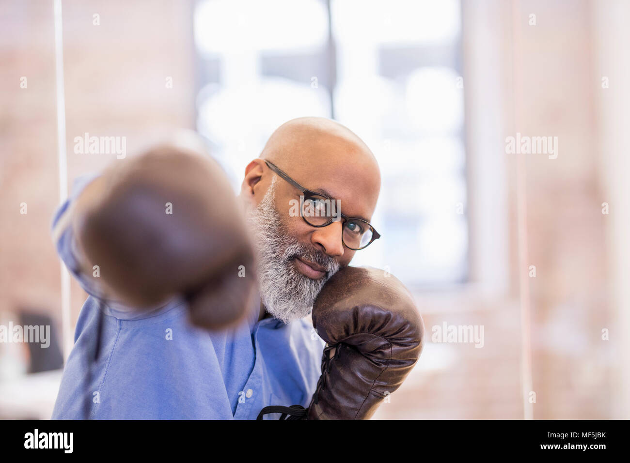 Portrait of businessman with boxing gloves Stock Photo