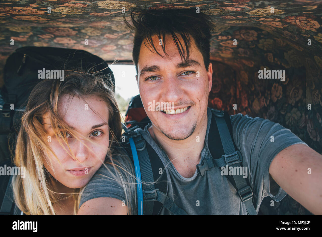 Young couple in a horse carriage taking a selfie Stock Photo