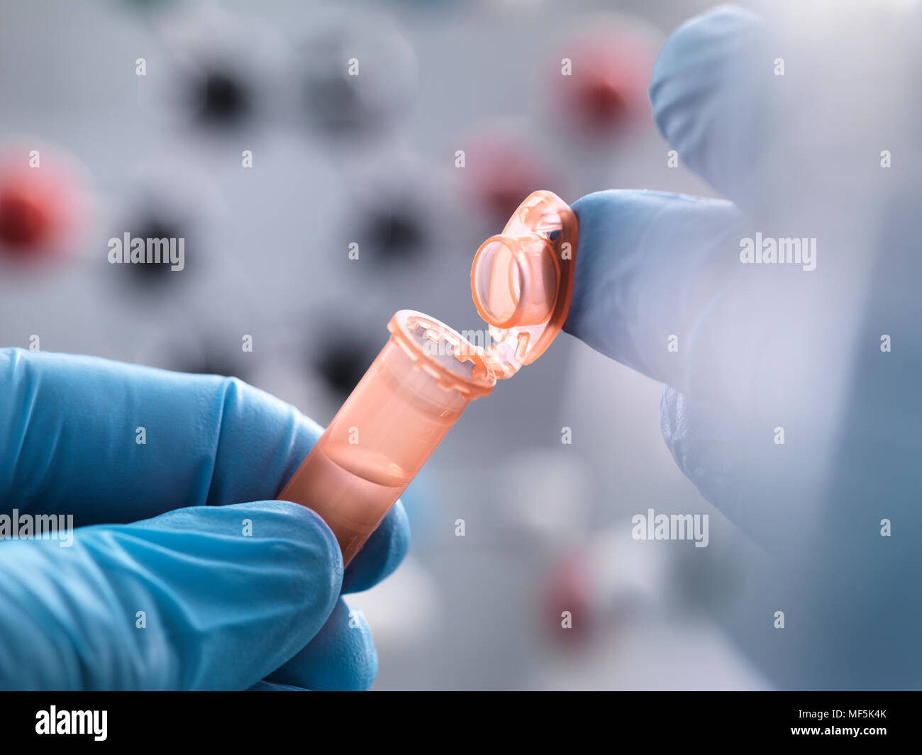 Scientist closing the eppendorf tube Stock Photo