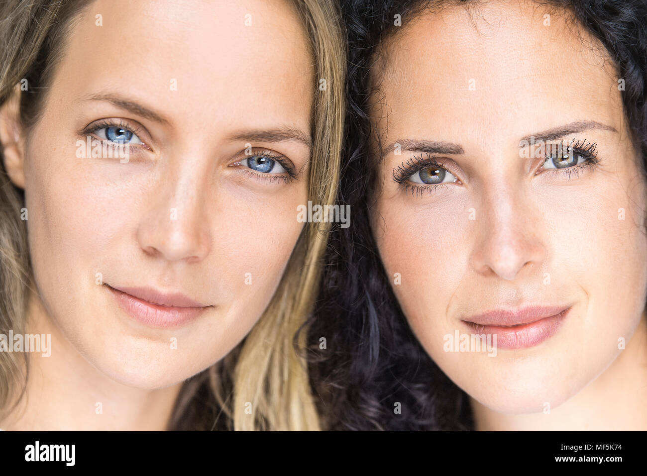 Portrait of two smiling women side by side Stock Photo