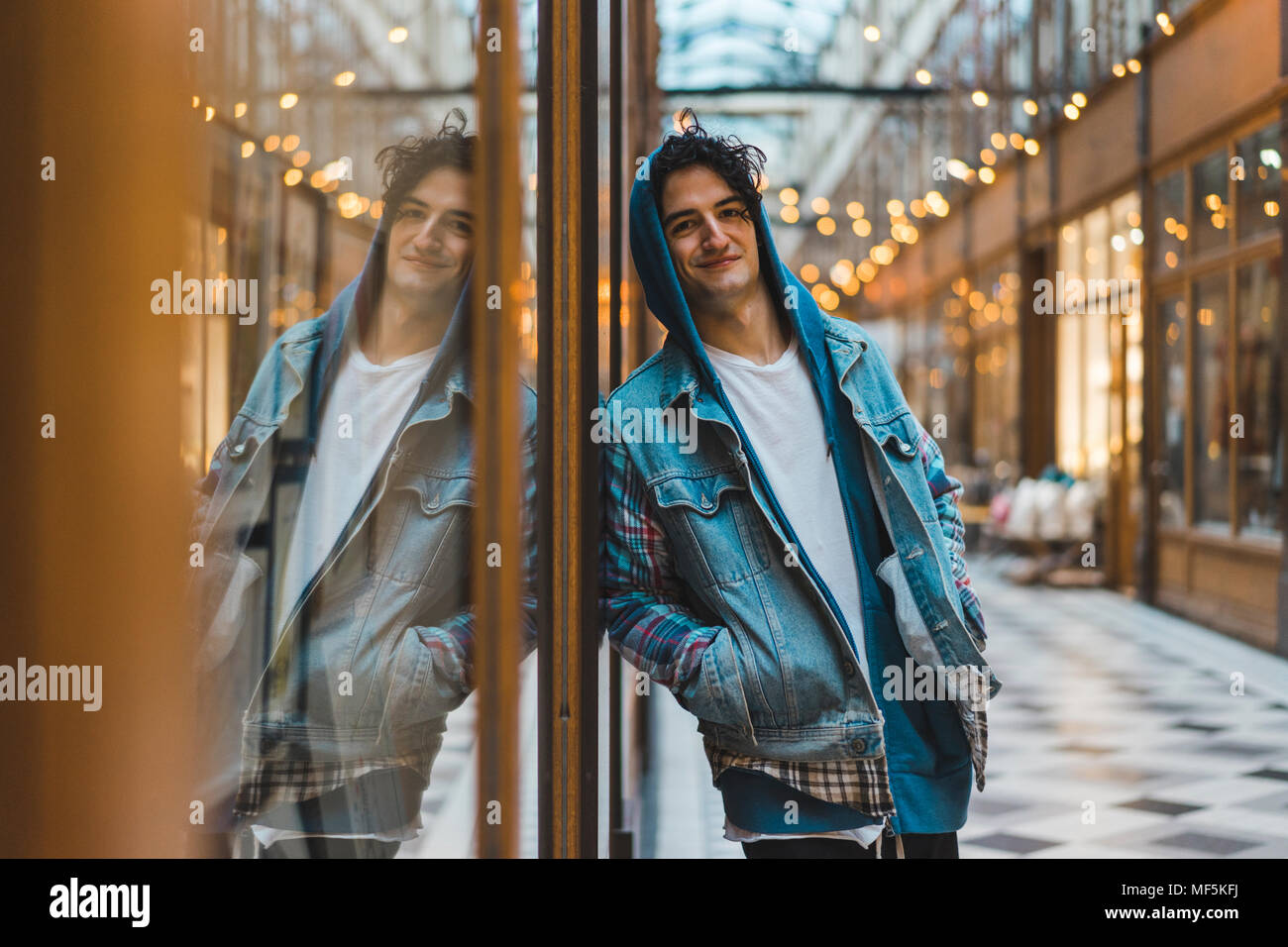 Young black man in hood hi-res stock photography and images - Alamy