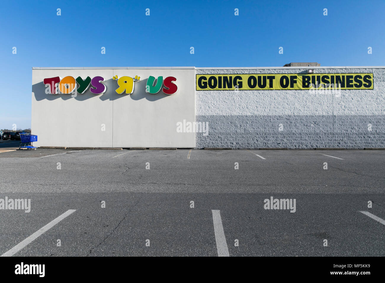 A logo sign outside of a Toys 'R' Us retail store in Lancaster, Pennsylvania with 'Going Out Of Business' and 'Store Closing' signage on April 22, 201 Stock Photo