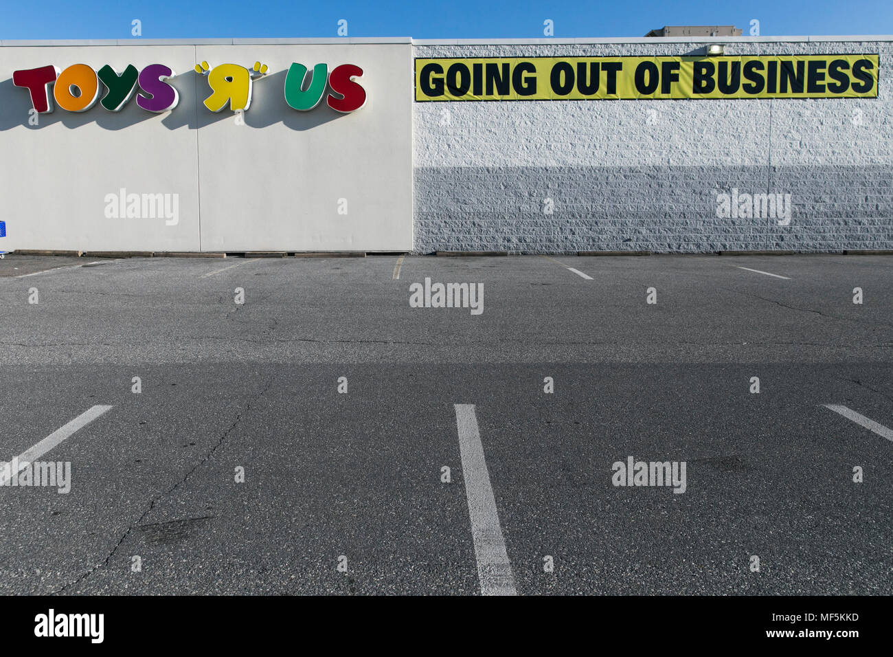 A logo sign outside of a Toys "R" Us retail store in Lancaster