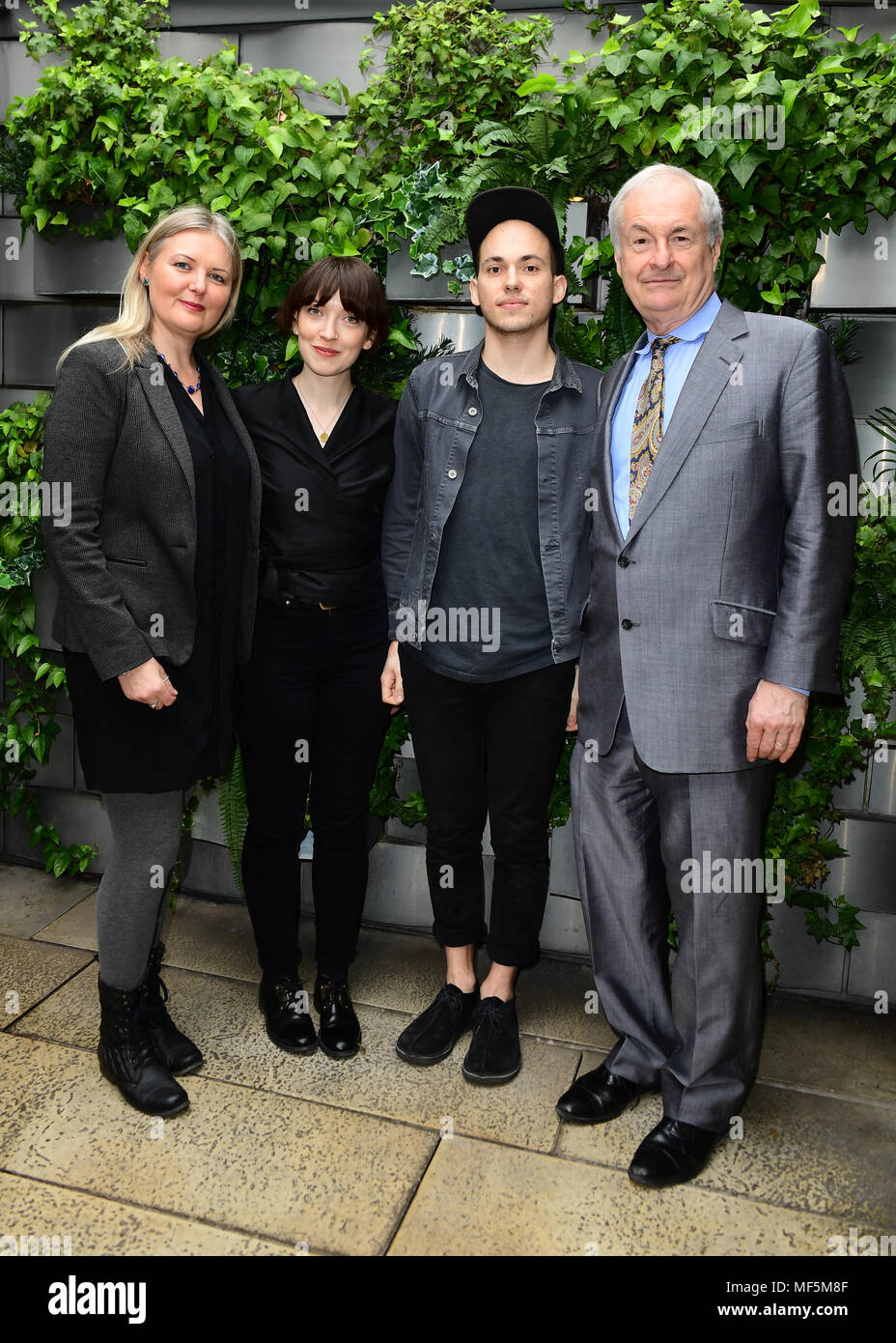 Vick Bain, Elena Tonra and Igor Haefeli of Daughter, and Host Paul  Gambaccini at the Nominations Announcement for the 63rd Ivor Novello  Awards. Daughter is nominated for Best Original Video Game score.