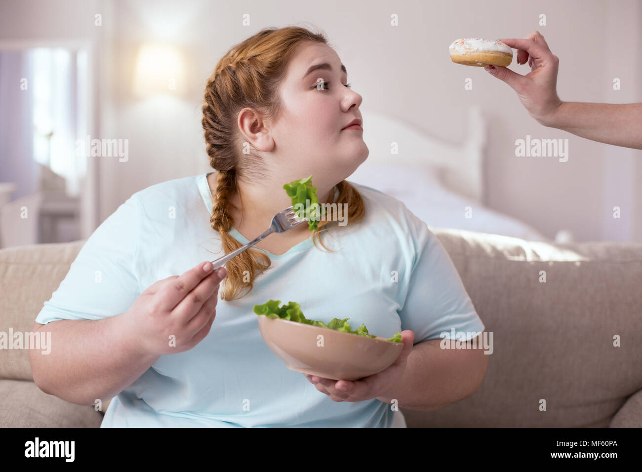 Sweet donut alluring young woman Stock Photo