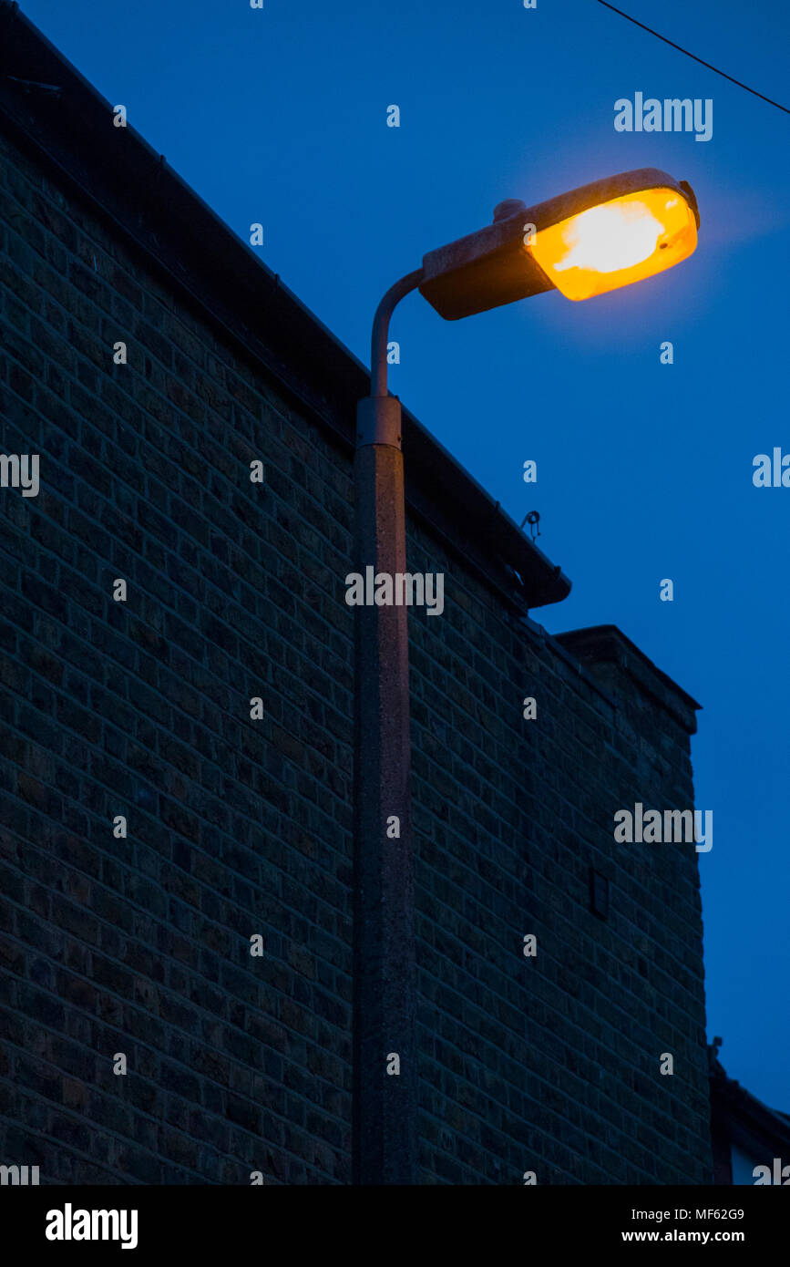 Street lamp / light / lights / lamps of an older sodium technology, soon to be replaced by LEDs. (96) Stock Photo