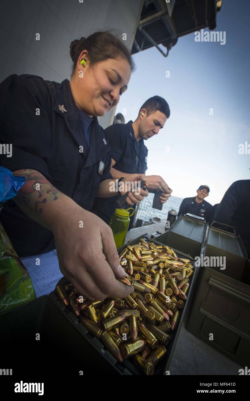 170109-N-BL607-154 ATLATIC OCEAN (Jan. 9, 2017) Gunner's Mate 1st Class Theresa Donahoe, left, from Torrance, Calif. and Fire Controlman 3rd Class Victor Diaz, from Santa Ana, Calif. load ammunition aboard the guided-missile cruiser USS Monterey (CG 61) during a small arms qualification, January 9, 2017. Monterey, deployed as part of the Eisenhower Carrier Strike Group, is conducting naval operations in the U.S. 6th Fleet area of operations in support of U.S. national security interests in Europe. (U.S. Navy photo by Mass Communication Specialist 2nd Class William Jenkins). () Stock Photo