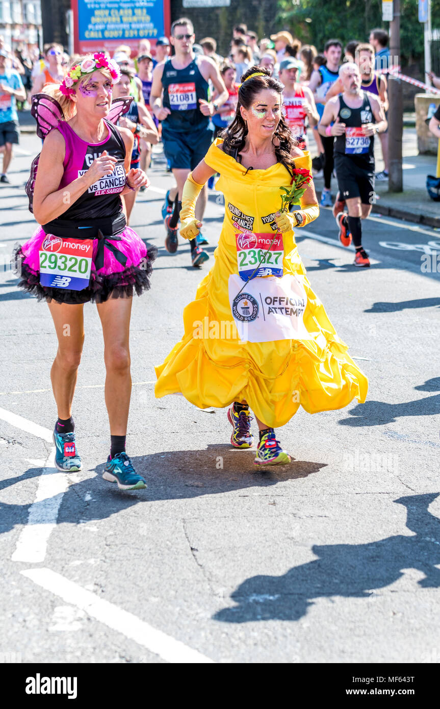 Two women in fancy dress running in the 2018 Virgin money London marathon Stock Photo