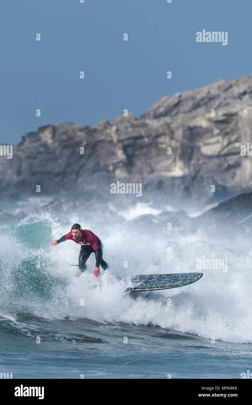 A surfer competing in a longboard competition at Fistral Beach; Newquay Cornwall; Stock Photo