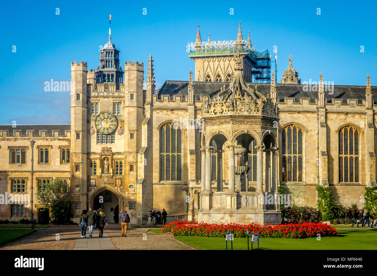 Cambridge, United kingdom - 123 Oct, 2016 : People walking in front of the famous Trinity college on a bright summer day, Cambridge Stock Photo