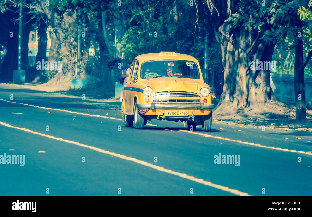 Kolkata, India - March 11th 2018: Iconic yellow taxi in Calcutta ( Kolkata ) India. The Ambassador taxi is no more built by Hindustan Motors but thous Stock Photo