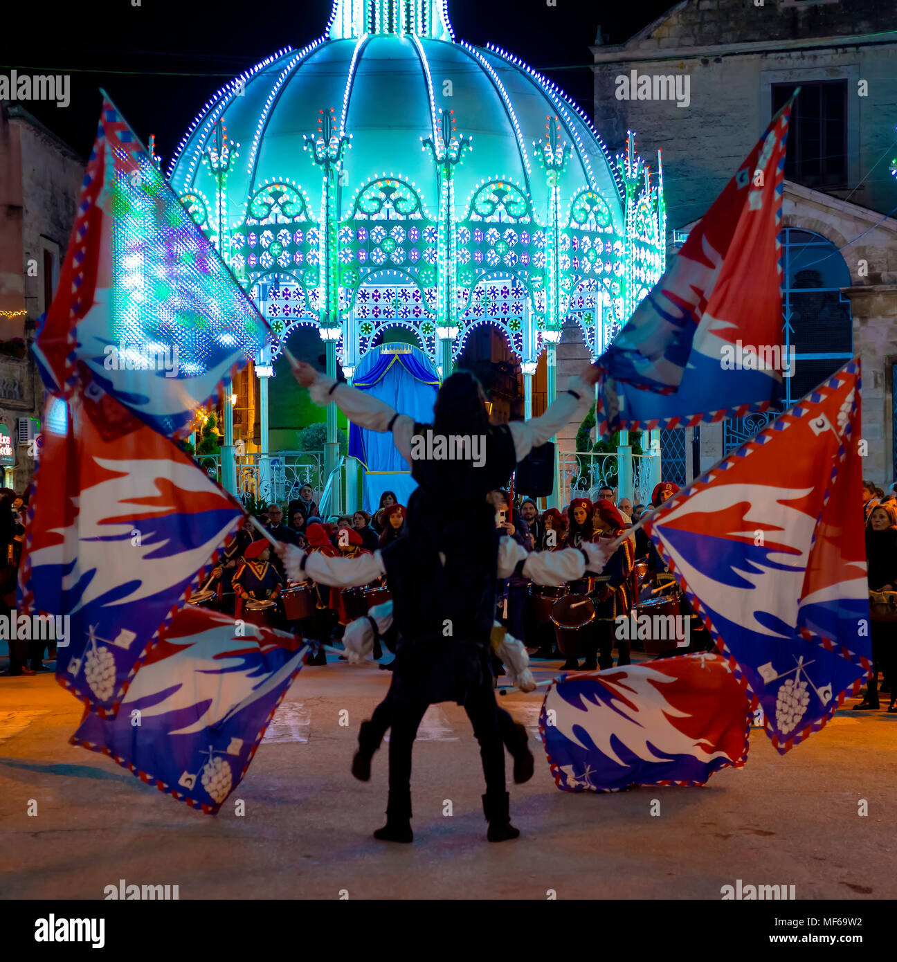 Modugno - ITALY. March 9, 2018: performance of a group of flag-wavers during the evening parade of the patronal feast Stock Photo