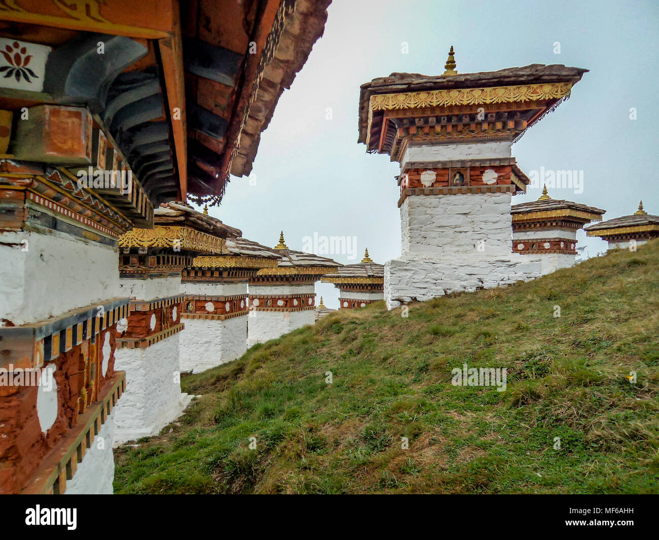 The 108 chortens or stupas is a memorial in honour of the Bhutanese soldiers with layer of mountains at Dochula Pass on the way to Thimphu from Punaka Stock Photo