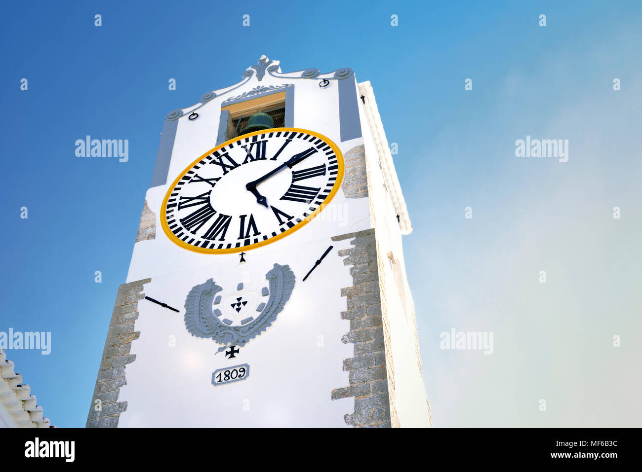 Medieval clock tower from down to up Stock Photo