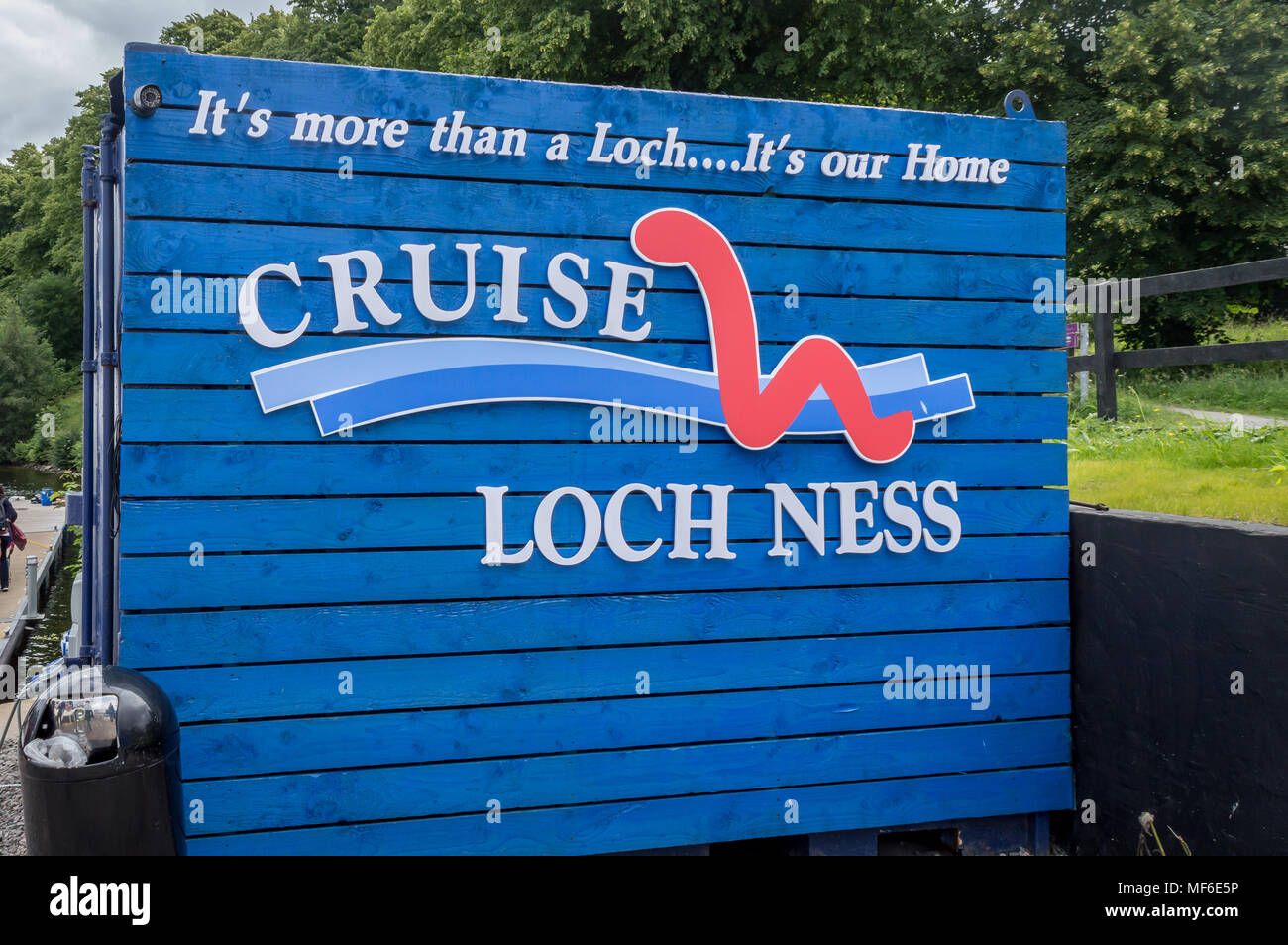 Loch Ness, Inverness, Scotland, UK - July 31, 2016: A board reading Cruise Loch Ness on the way to the famous Loch Ness, Scotland, United Kingdom Stock Photo