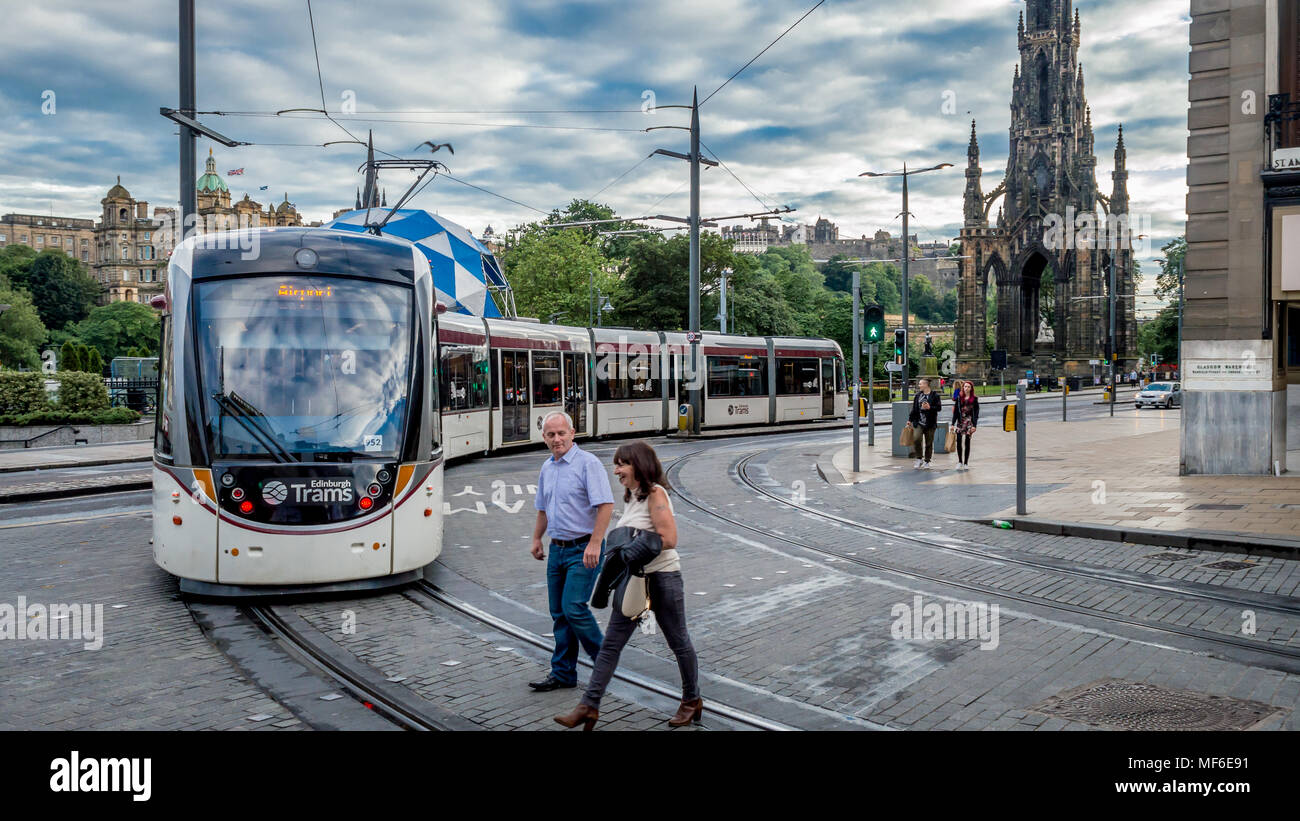 EDINBURGH, UNITED KINGDOM - AUGUST 1, 2016: A tram with Sir Walter Scott's monument in the background at Princes Street Stock Photo