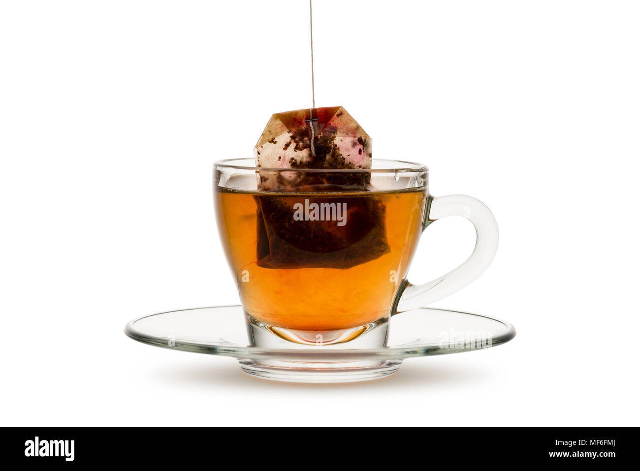tea in glass cup with tea bag, on white background Stock Photo